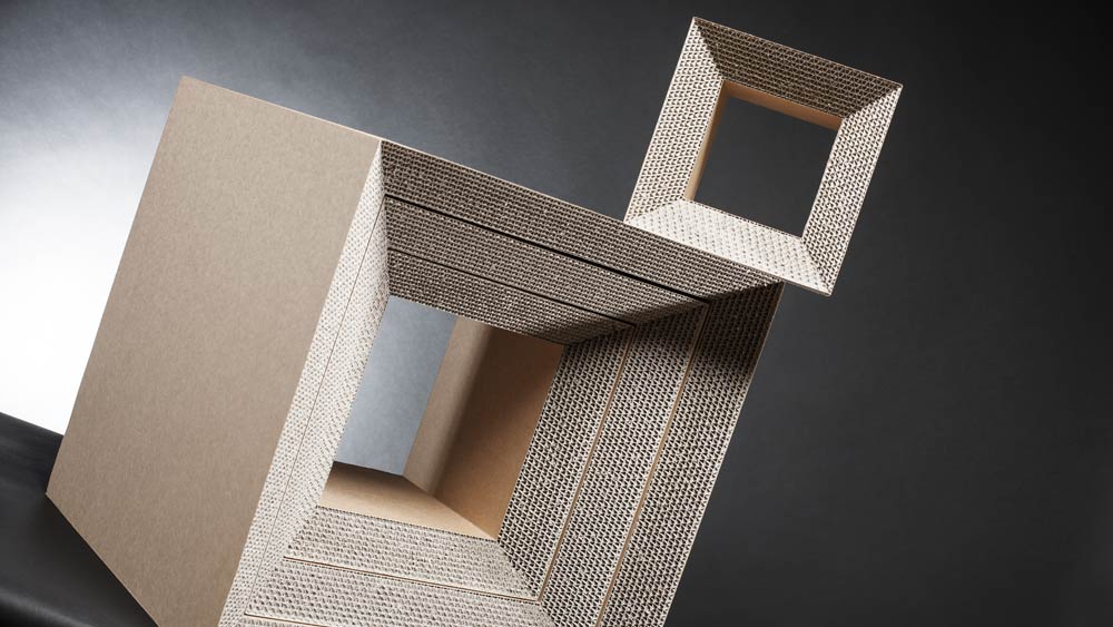 4 dices of our cardboard shelf made of recycled paper fit into each other and form a table, a very stable cardboard stool and two small boxes